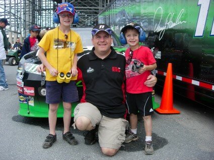 <i>Kyle, me, and Erik in front of Denny Hamlin's car.</i>